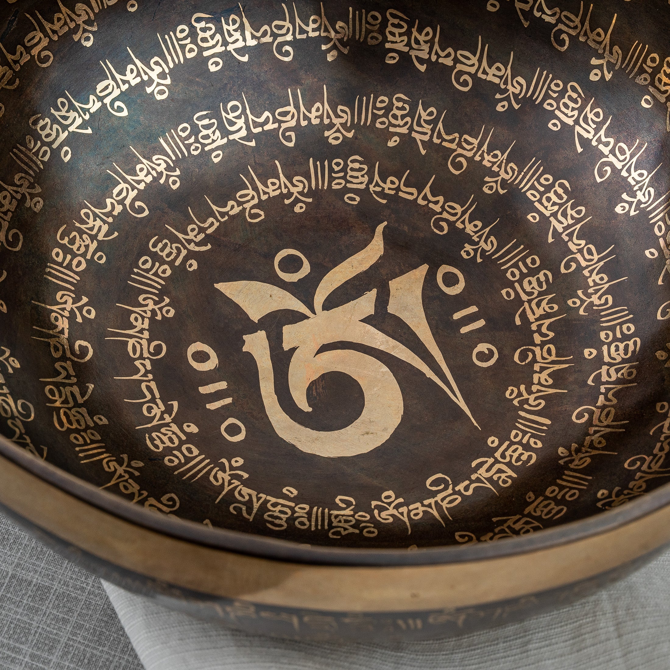 Close inside view of Om singing bowl