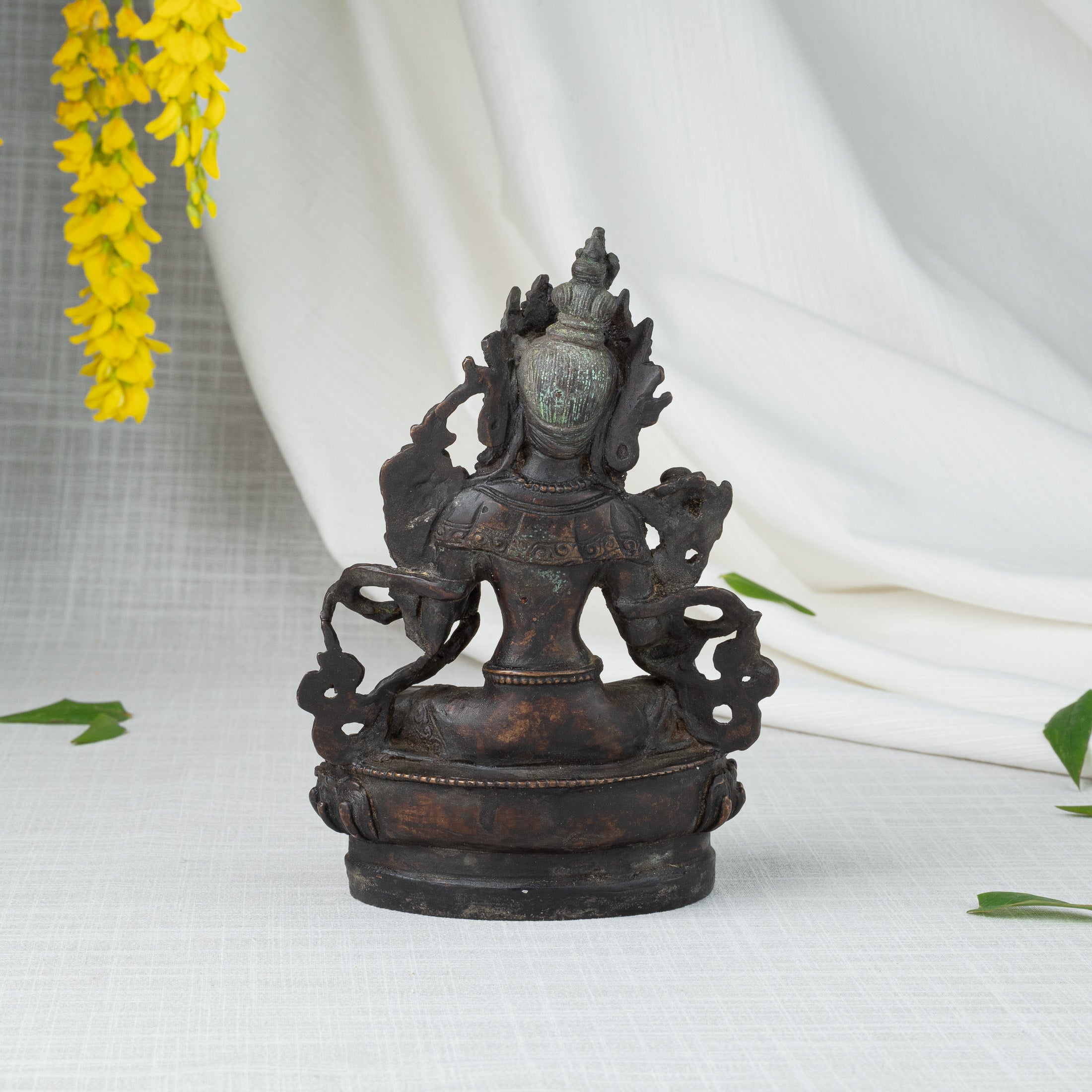 Back view of Green Tara statue