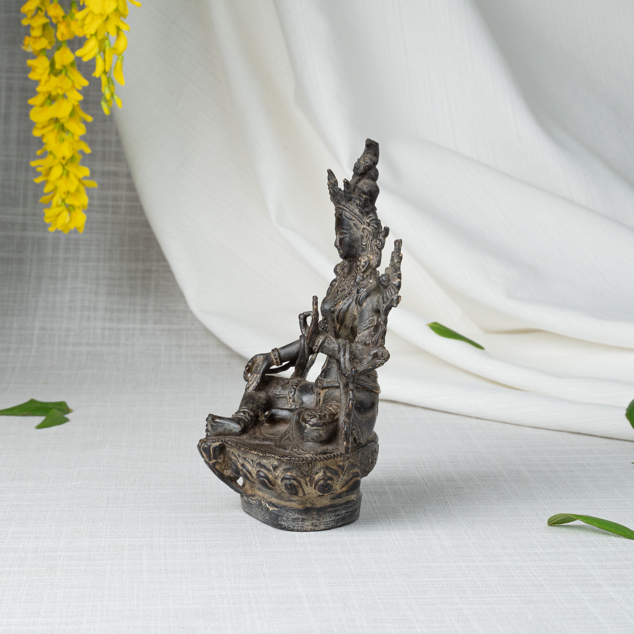 Side view of Green Tara statue