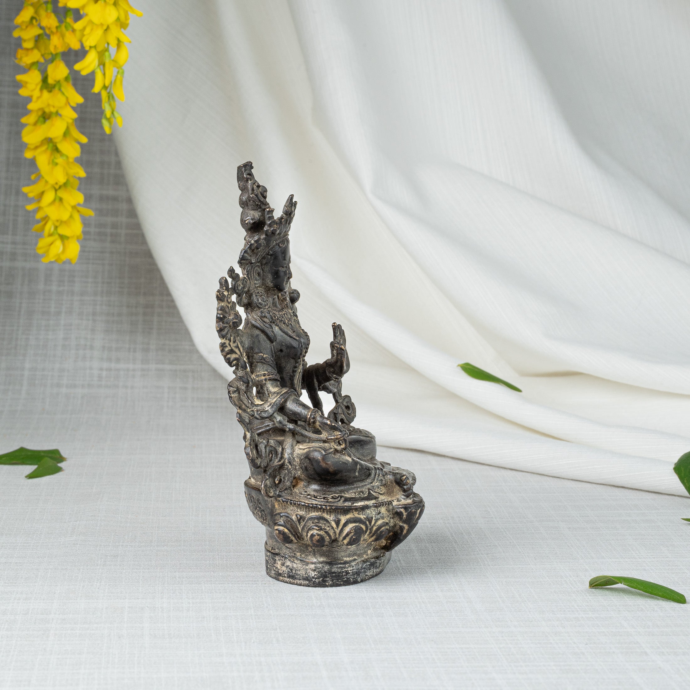 Side view of Green Tara statue