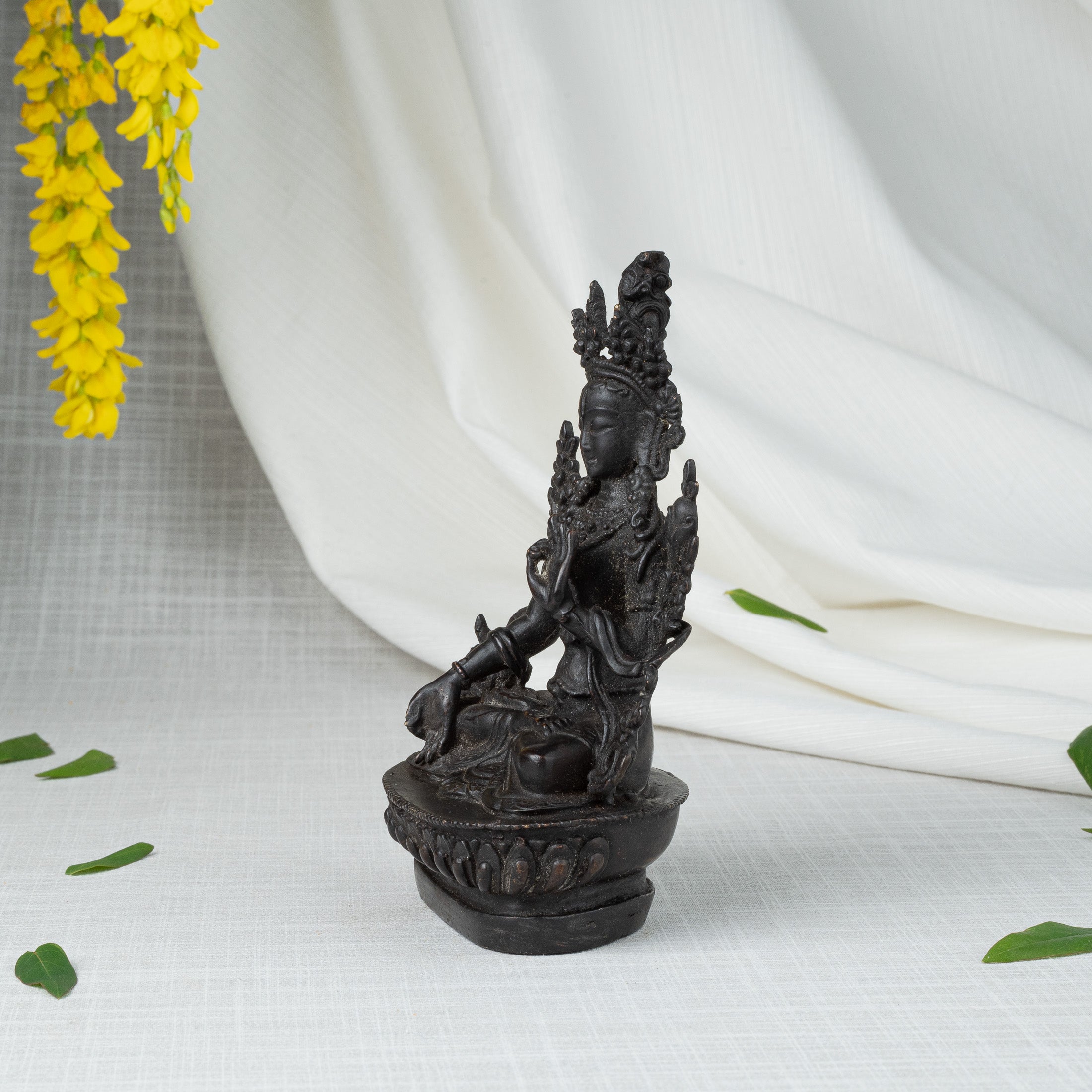 Side view of White Tara statue