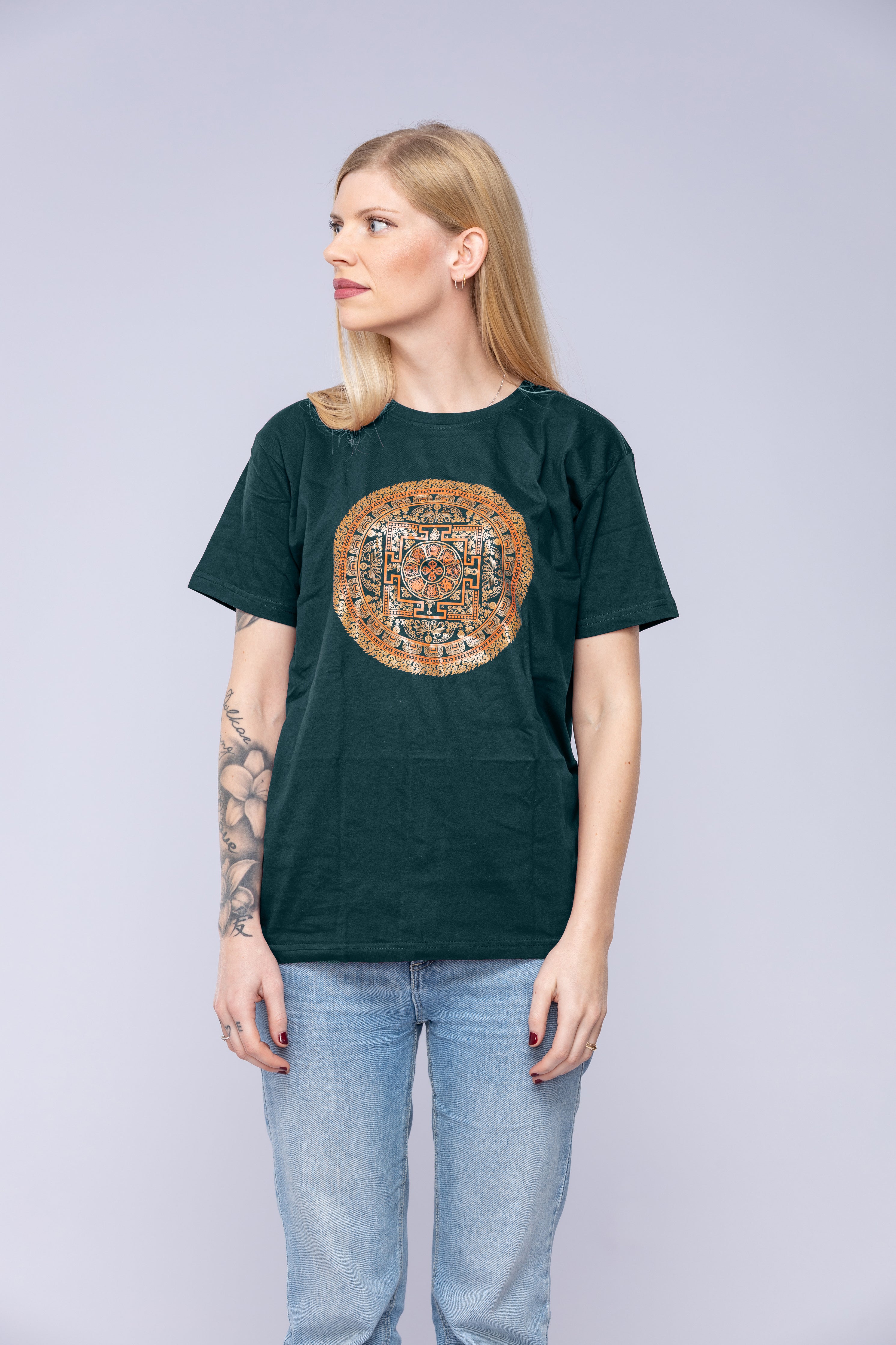 Woman wearing green Vajra mandala t-shirt