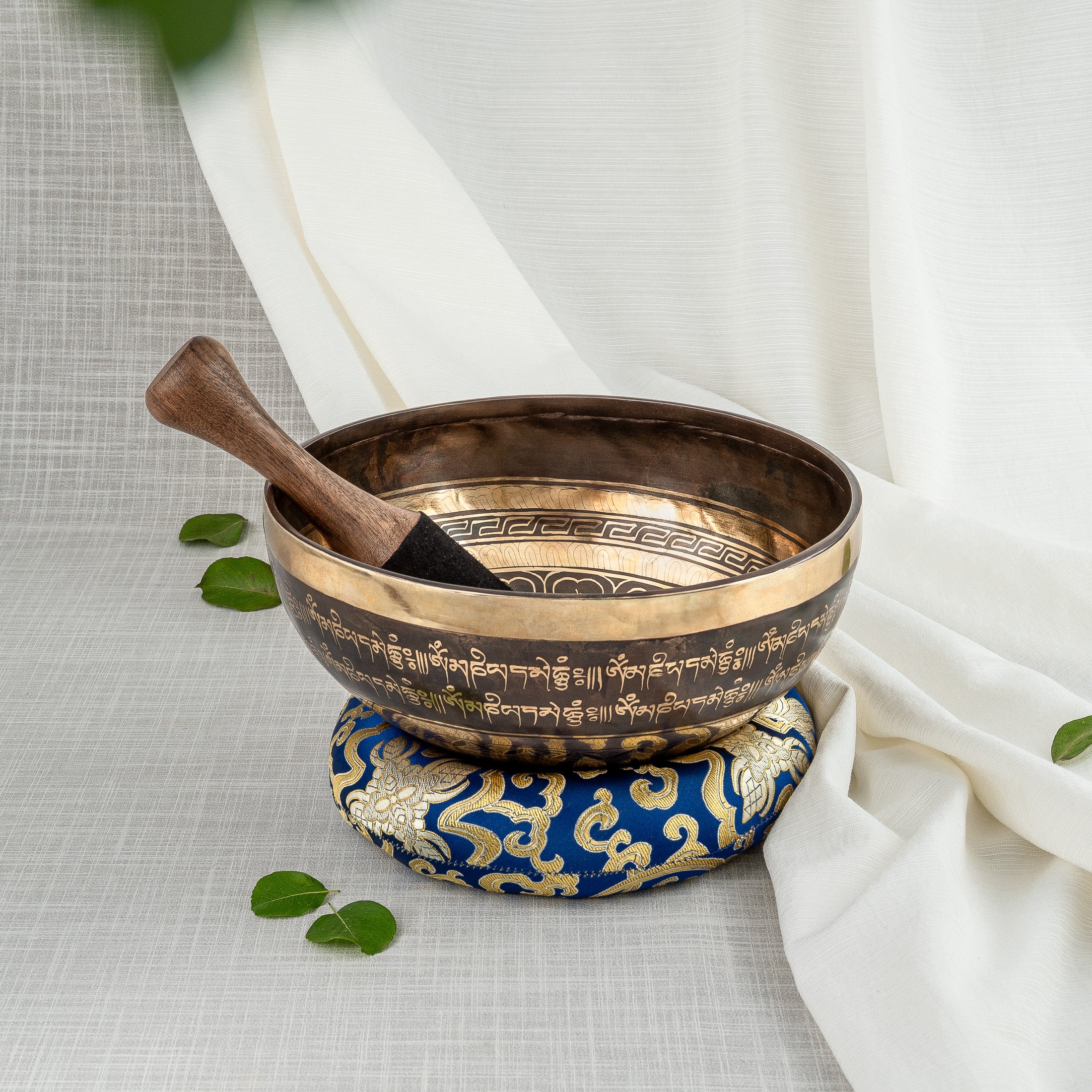 Crossed Vajra Singing bowl, mallet and blue cushion