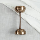 Close up of double sided singing bowl in handle