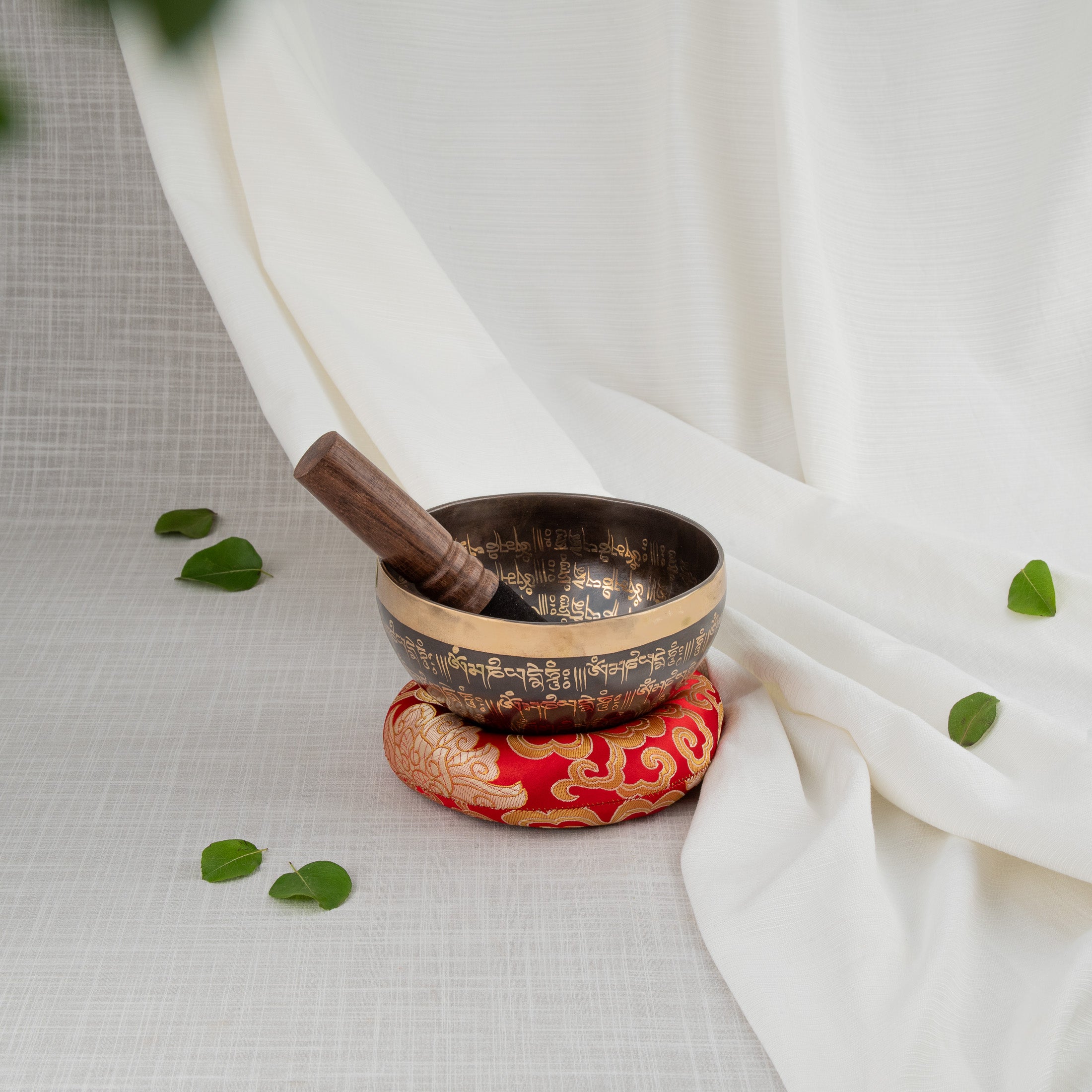 Front view of small om singing bowl