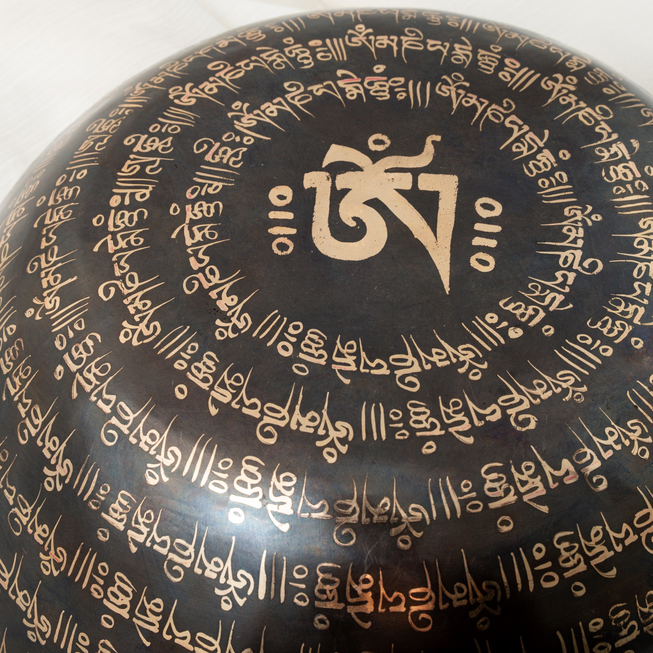 Close-up bottom view of eyes of buddha singing bowl