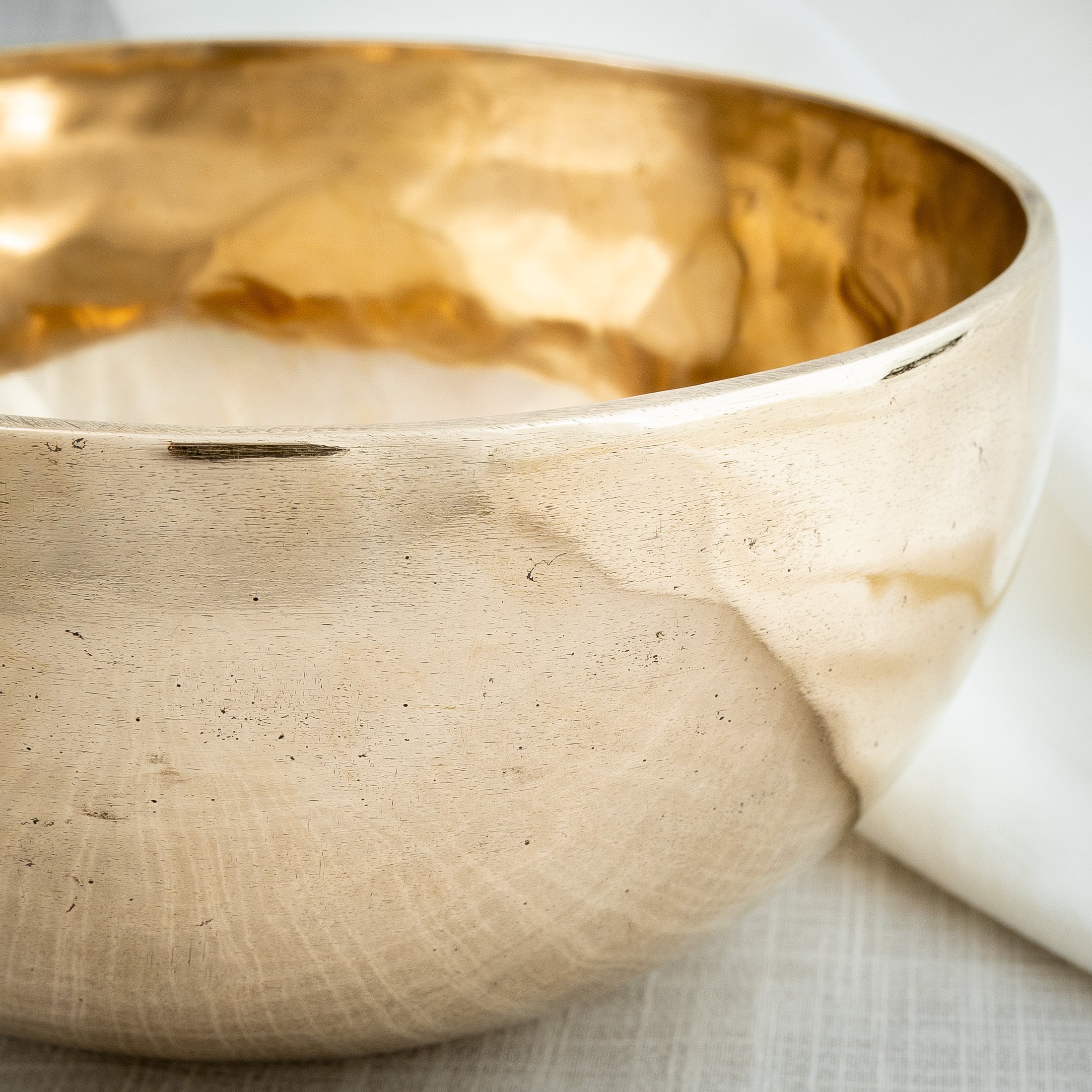 Close-up of reflective Tibetan singing bowl