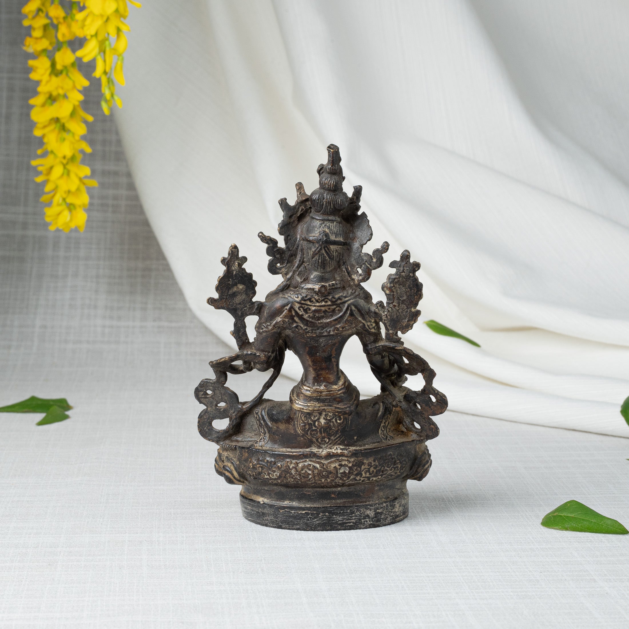 Back view of Green Tara statue