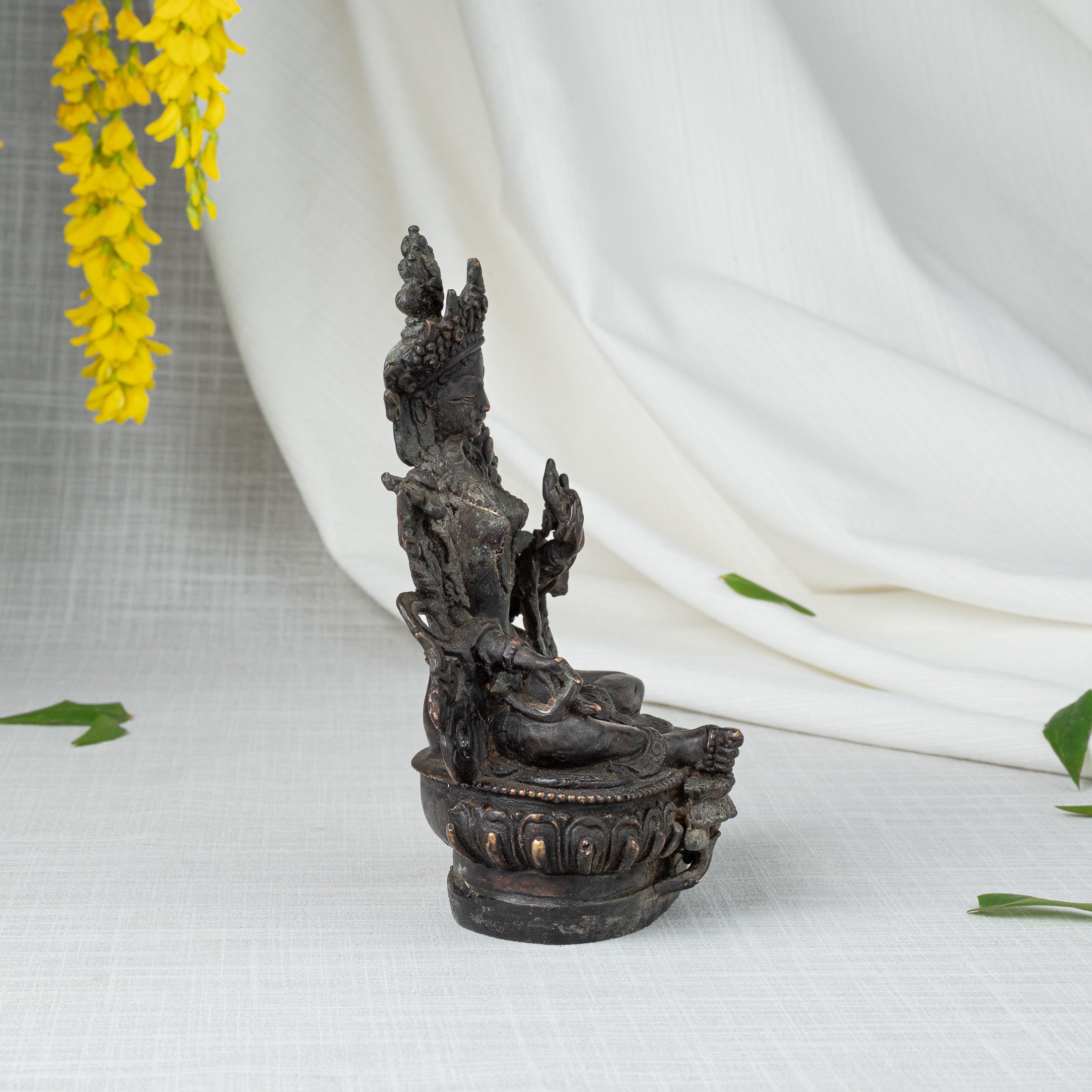 Side view of Green Tara statue