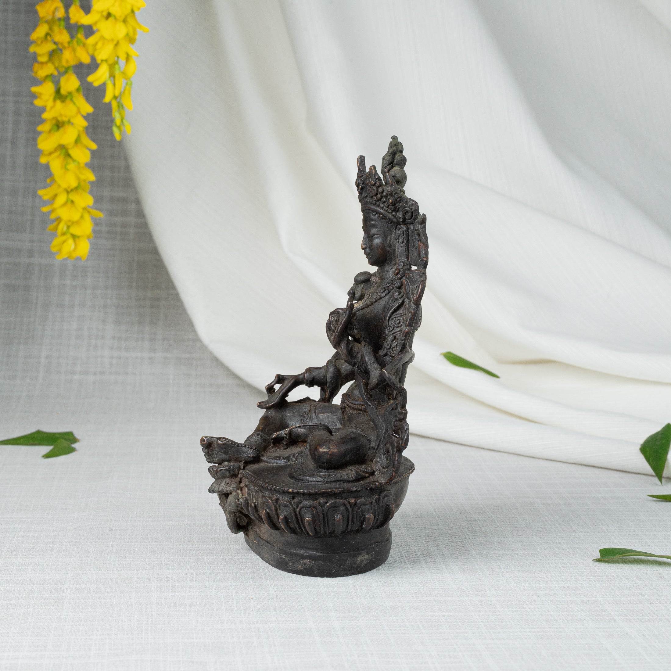 Side view of Green Tara statue