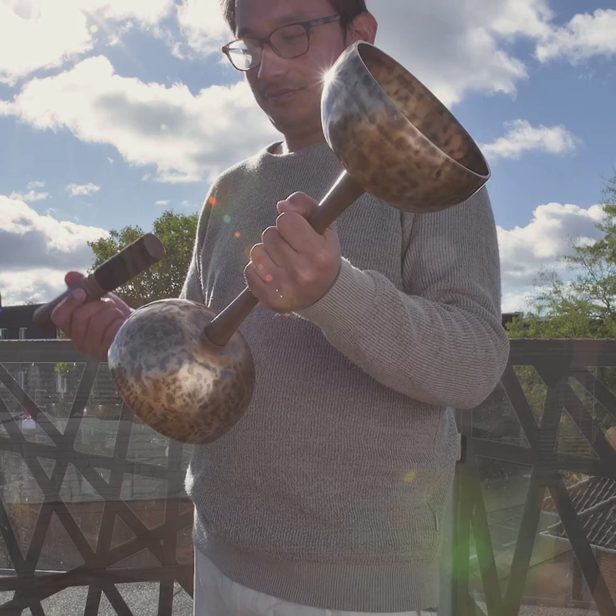 Video of double sided singing bowl in handle
