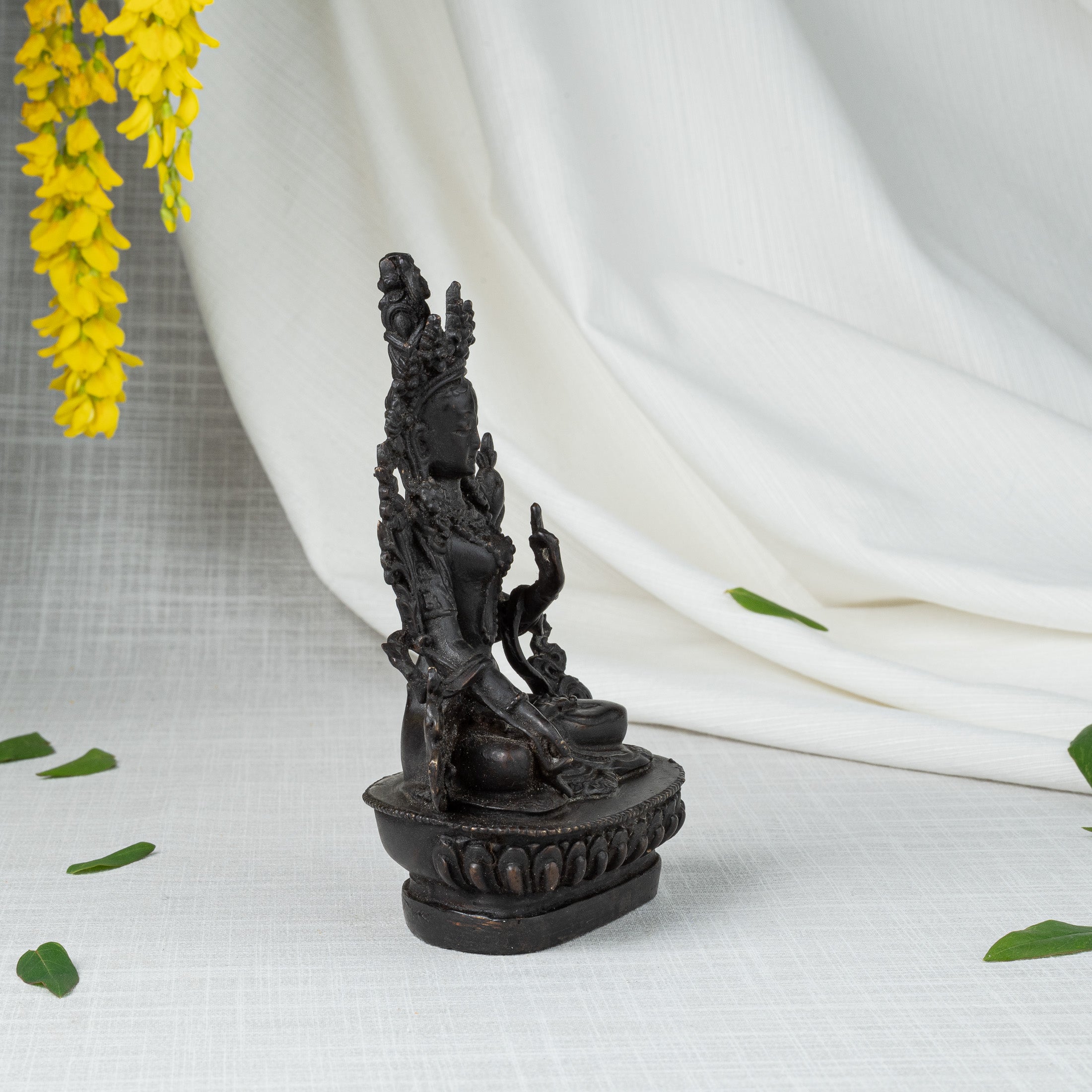 Side view of White Tara statue